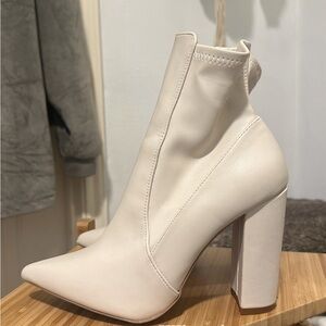 White pointed toe booties